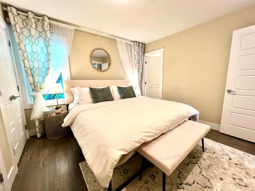 Unwind in this elegant bedroom featuring a plush king-size bed, soft lighting, and refined décor — designed to offer the perfect night’s rest in comfort and style.
