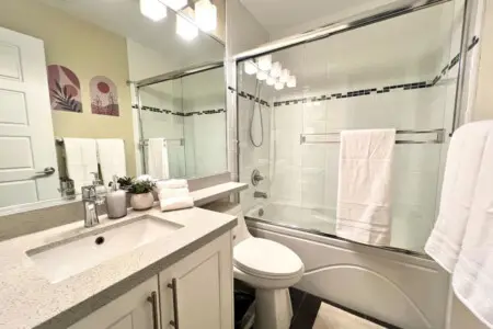 Luxurious and thoughtfully designed, this second-floor full bathroom is conveniently located near the primary bedroom and laundry area, offering comfort and modern elegance.