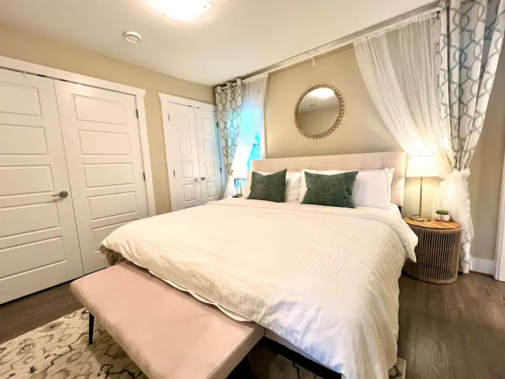 Spacious and serene, this inviting bedroom features a luxurious king-sized bed, elegant decor, and soft lighting for the perfect retreat.