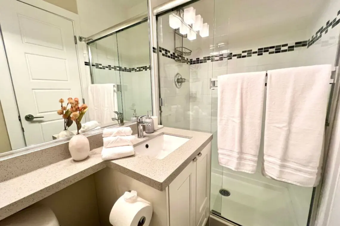 Bright and modern, this first-floor full bathroom offers a refreshing space complete with all essential amenities and fresh towels for your stay.