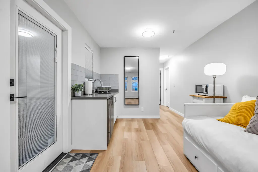 A bright and compact kitchen area designed for convenience and comfort — perfect for enjoying your morning coffee, preparing simple meals, or winding down with a late-night snack.