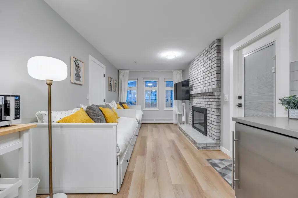 A bright and welcoming living area designed for comfort and connection — perfect for cozy nights by the fire, movie marathons, or simply unwinding with loved ones after a day exploring the city.