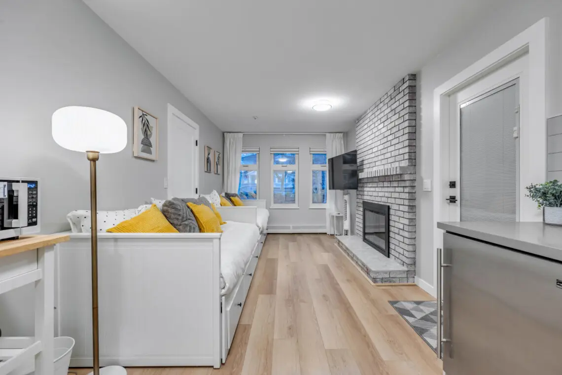 A bright and welcoming living area designed for comfort and connection — perfect for cozy nights by the fire, movie marathons, or simply unwinding with loved ones after a day exploring the city.