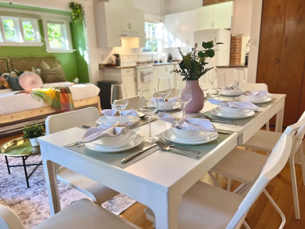 Bright and thoughtfully arranged, this open dining area invites guests to enjoy home-cooked meals and warm conversation in modern comfort. A welcoming touch to this stylish Vancouver stay.