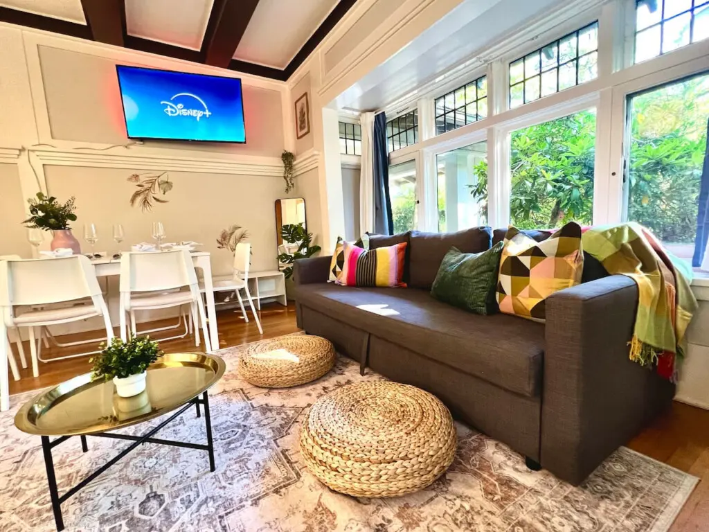 Bright and inviting, this cozy living space is perfect for relaxing, streaming shows, or sharing meals together. A stylish urban escape filled with warmth and natural light.
