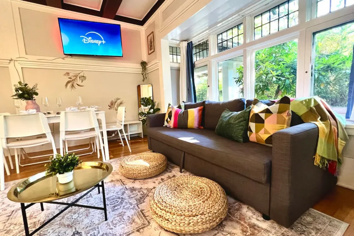 Bright and inviting, this cozy living space is perfect for relaxing, streaming shows, or sharing meals together. A stylish urban escape filled with warmth and natural light.