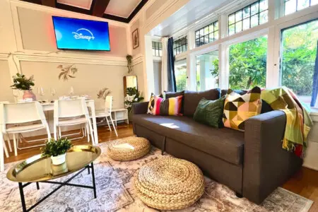 Bright and inviting, this cozy living space is perfect for relaxing, streaming shows, or sharing meals together. A stylish urban escape filled with warmth and natural light.