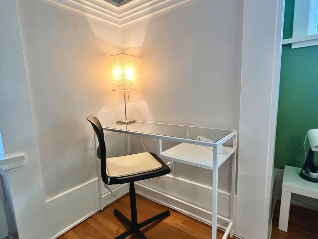 A minimalist workspace tucked into a bright corner — perfect for remote work, journaling, or quiet moments during your Vancouver stay.