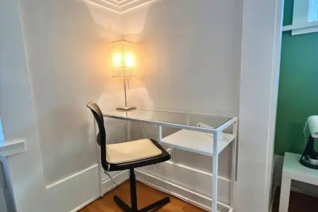 A minimalist workspace tucked into a bright corner — perfect for remote work, journaling, or quiet moments during your Vancouver stay.