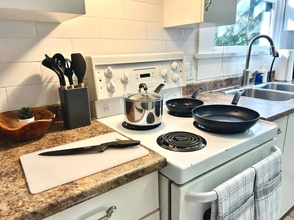 A bright, well-equipped kitchen offers everything guests need for effortless home cooking. Enjoy modern convenience and cozy touches that make every Vancouver stay feel like home.