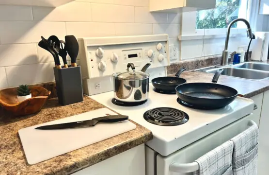 A bright, well-equipped kitchen offers everything guests need for effortless home cooking. Enjoy modern convenience and cozy touches that make every Vancouver stay feel like home.
