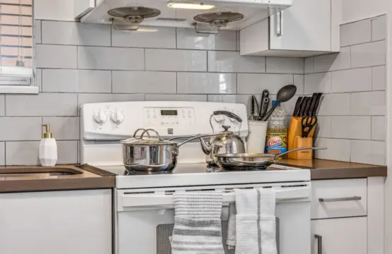 Prepare delicious home-cooked meals in this fully equipped kitchen, complete with modern cookware and essentials for a comfortable Vancouver stay.