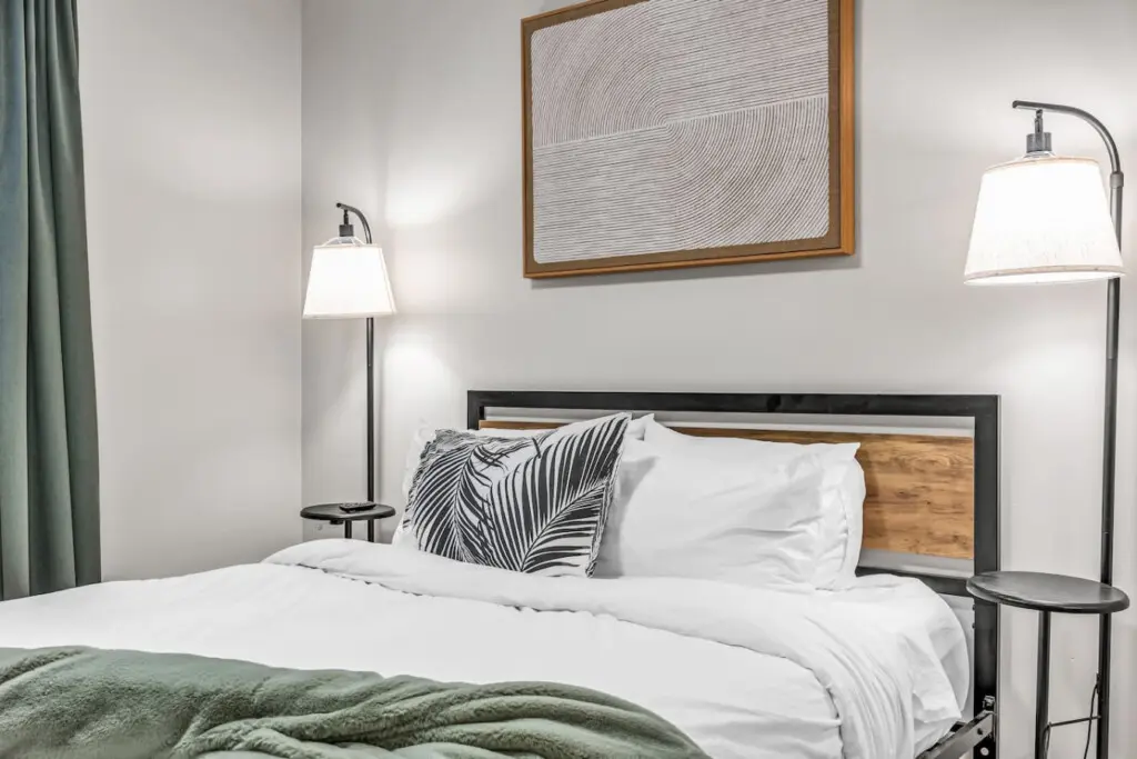 A cozy and modern bedroom featuring soft lighting and fresh linens — ideal for restful nights and peaceful mornings.