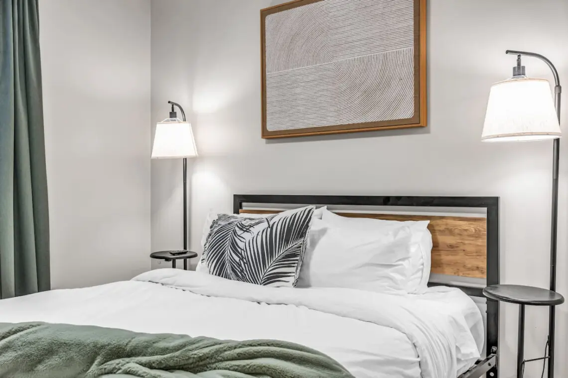 A cozy and modern bedroom featuring soft lighting and fresh linens — ideal for restful nights and peaceful mornings.