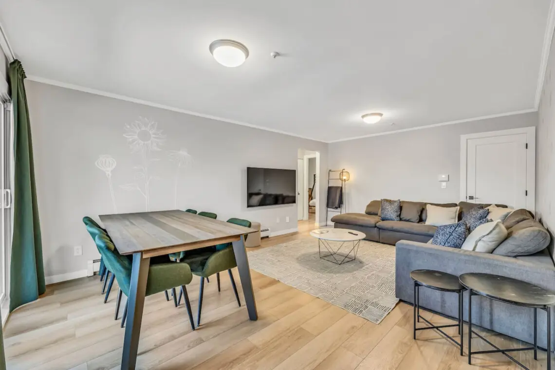 Spacious and welcoming, this living area features plush couches perfect for relaxing after a full day of exploring Vancouver. A cozy retreat for conversation, movies, or quiet downtime.