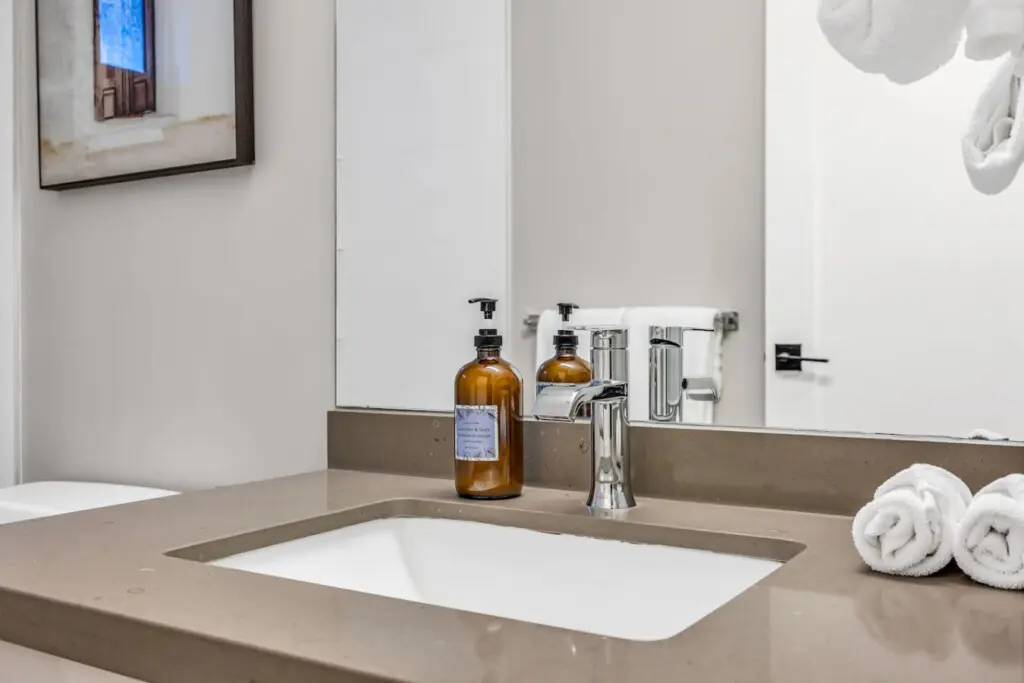 A clean, modern bathroom featuring sleek finishes and fresh essentials — designed for comfort and relaxation throughout your Vancouver stay.