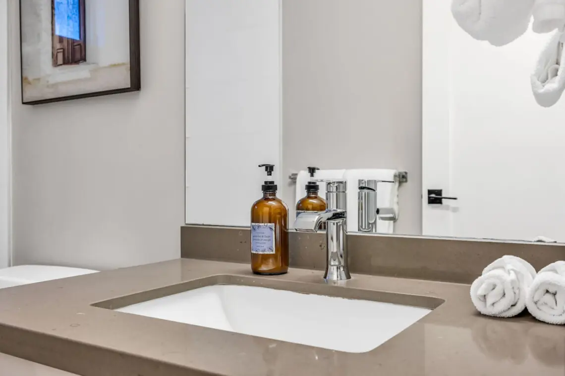 A clean, modern bathroom featuring sleek finishes and fresh essentials — designed for comfort and relaxation throughout your Vancouver stay.