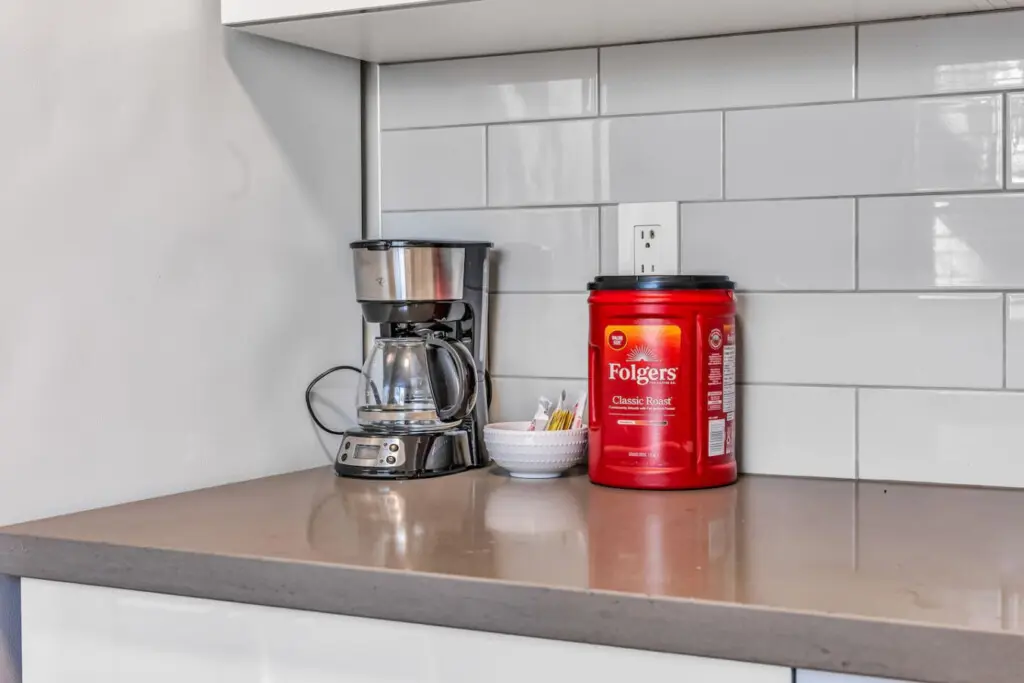 Start your day right with the perfect cup of coffee — a convenient setup complete with a coffee maker, classic roast blend, and all the essentials for your morning brew.