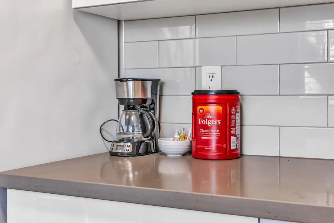 Start your day right with the perfect cup of coffee — a convenient setup complete with a coffee maker, classic roast blend, and all the essentials for your morning brew.