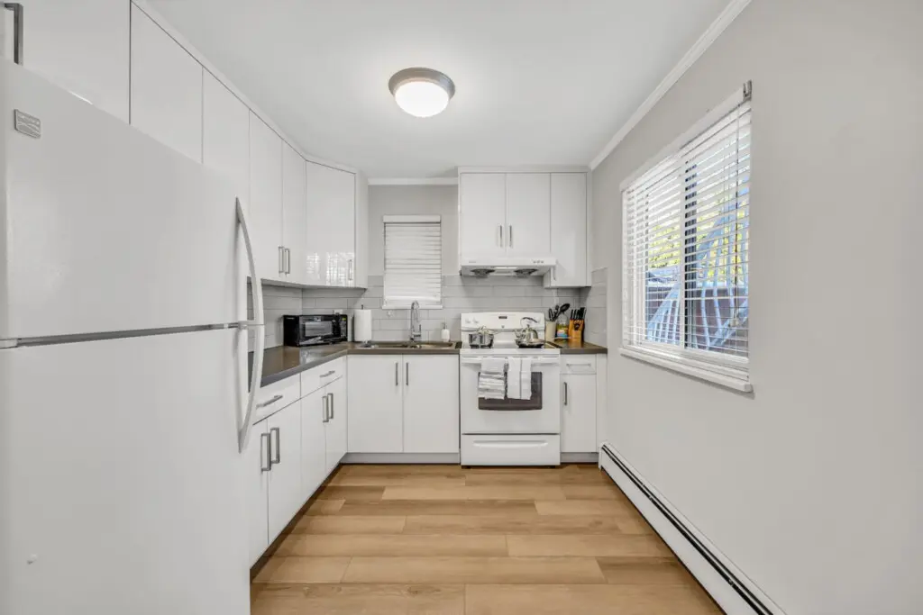 A bright, modern kitchen equipped with all the essentials — perfect for preparing home-cooked meals and enjoying the comforts of your Vancouver stay.