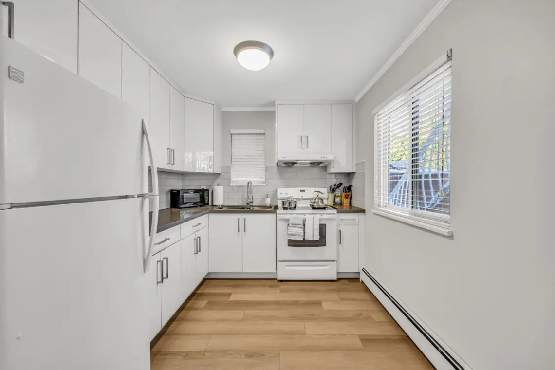 A bright, modern kitchen equipped with all the essentials — perfect for preparing home-cooked meals and enjoying the comforts of your Vancouver stay.