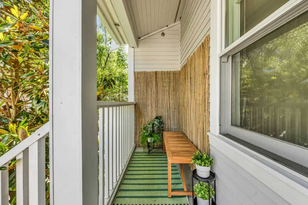 Cozy patio surrounded by greenery — the perfect spot to unwind with your morning coffee or enjoy a peaceful moment outdoors.