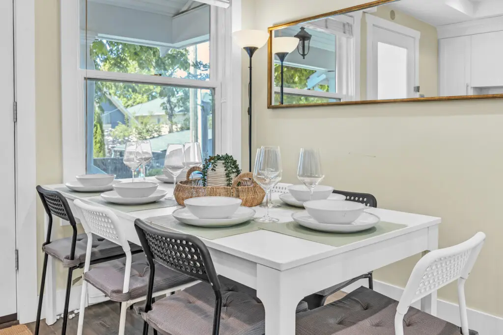 Inviting dining area set for 7–8 guests, perfect for enjoying shared meals, laughter, and meaningful moments together in a cozy and welcoming atmosphere.