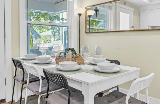 Inviting dining area set for 7–8 guests, perfect for enjoying shared meals, laughter, and meaningful moments together in a cozy and welcoming atmosphere.