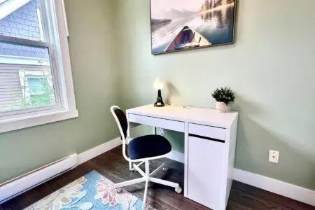 Dedicated workspace located in the 3rd bedroom with a comfortable chair and sturdy desk—ideal for remote work or planning your day.