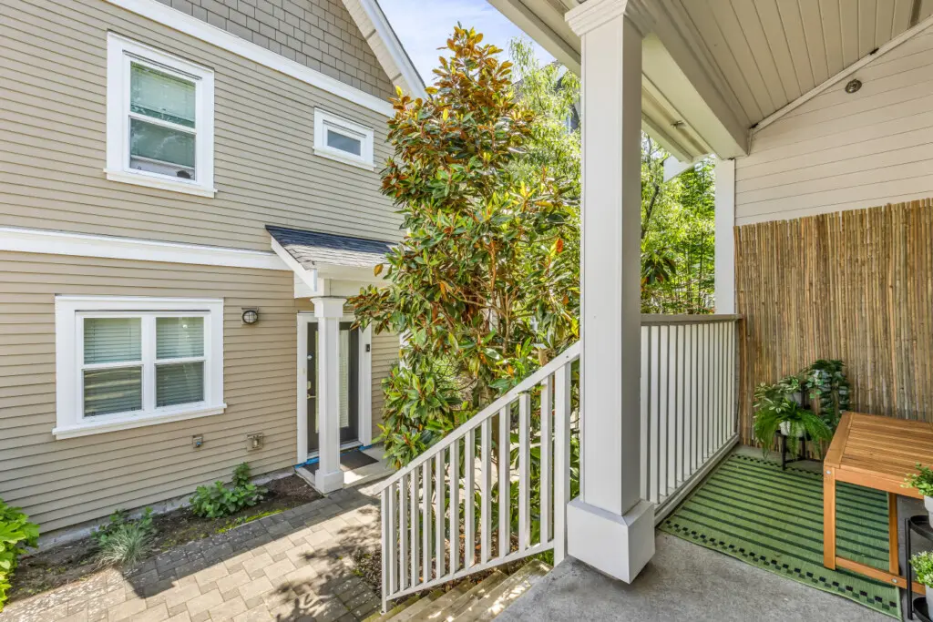 Inviting and private entrance surrounded by vibrant greenery, creating a peaceful transition from the outdoors into your relaxing home away from home — perfect for a quiet morning or evening unwind.