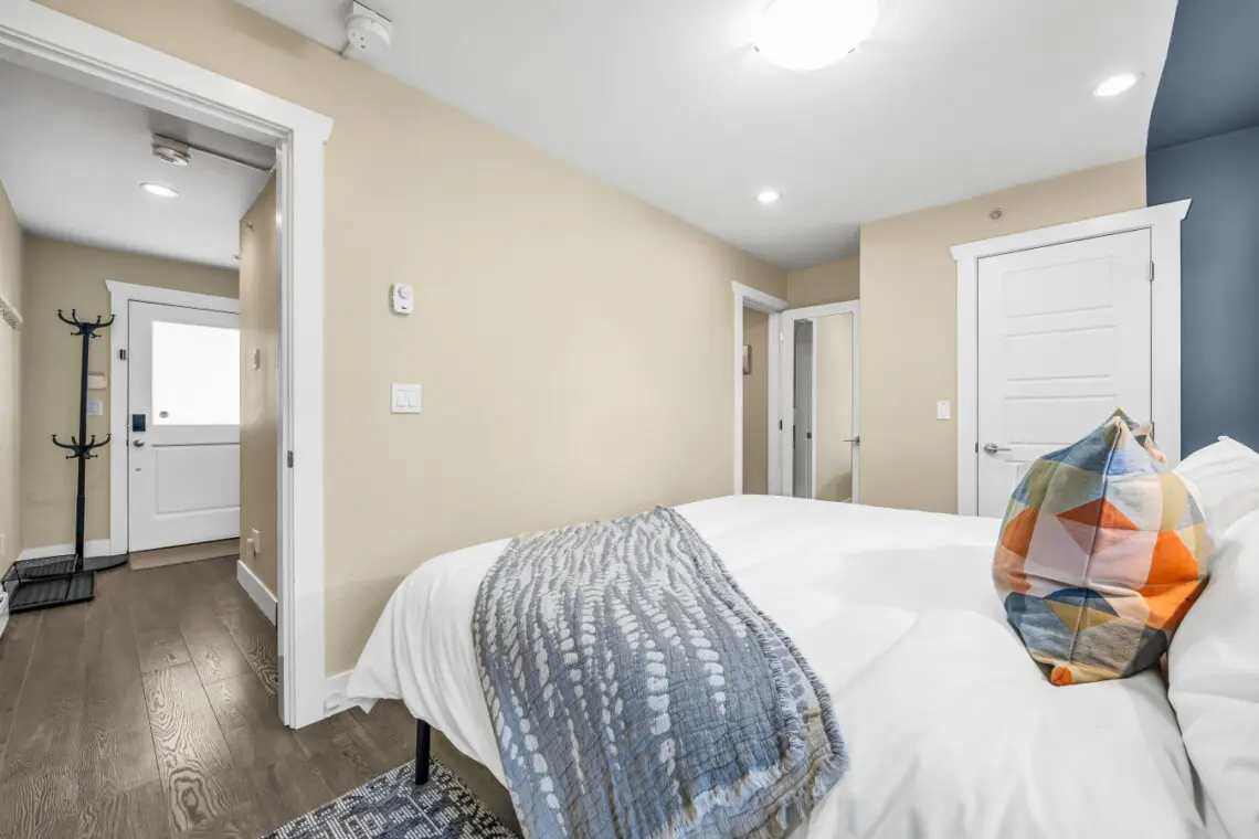 Well-appointed 1st bedroom with a King sized bed designed for relaxation, complete with luxurious bedding.