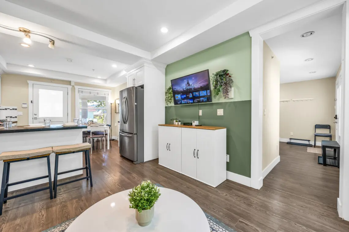 Open-concept living area with a seamless flow into the fully equipped kitchen—perfect for relaxing and entertaining.