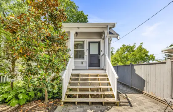 Welcoming front entry with charming steps and greenery, setting a peaceful tone as you arrive at your relaxing home retreat.