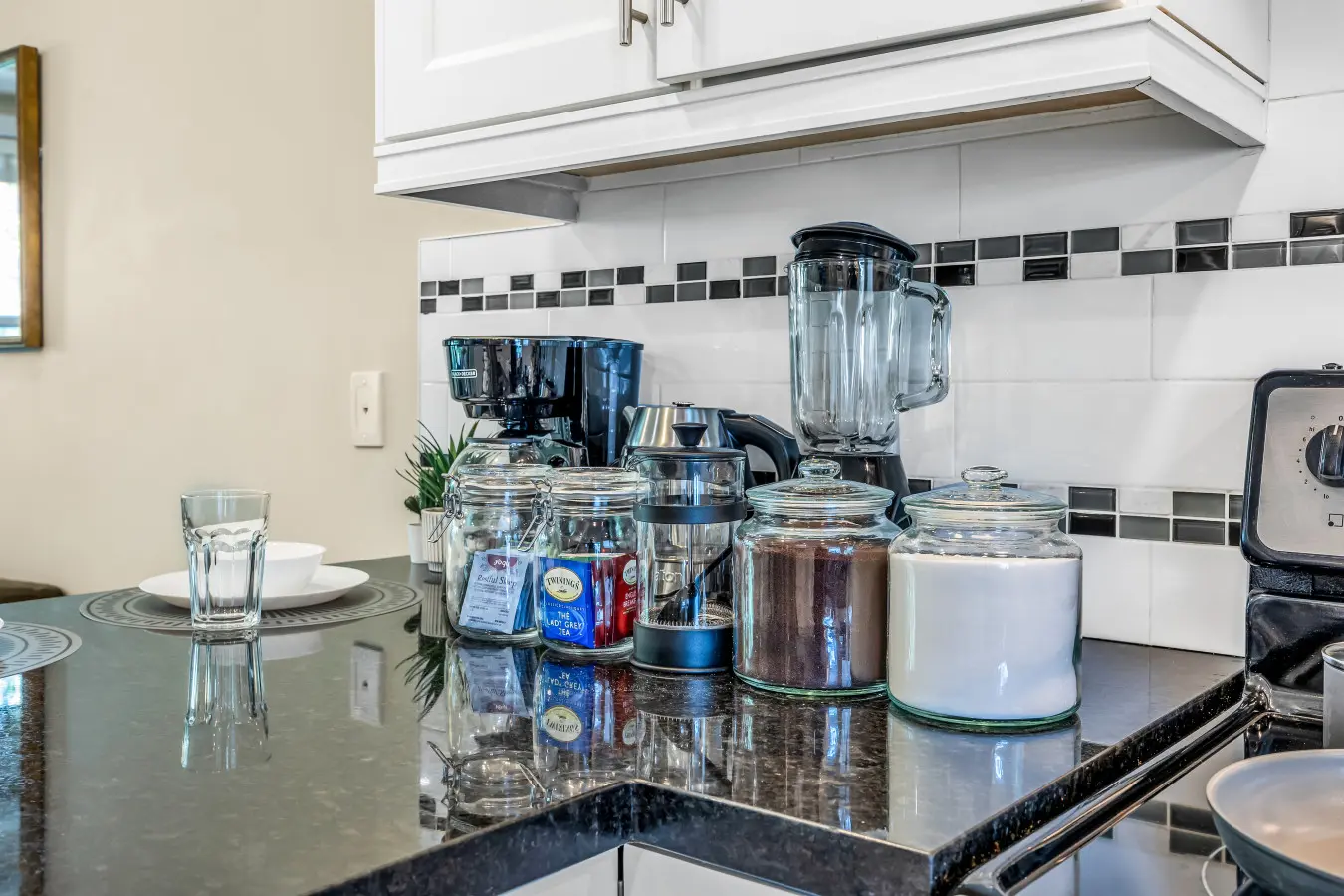 Fully stocked coffee and tea station featuring regular and decaf coffee, black teas, and herbal blends — the perfect spot to start your morning or unwind any time of day.