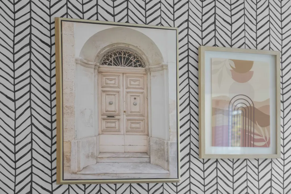 Thoughtfully chosen artwork adds warmth and personality to the second bedroom. The soft hues and clean lines complement the room’s modern aesthetic, creating a calm and stylish atmosphere that embodies contemporary comfort.