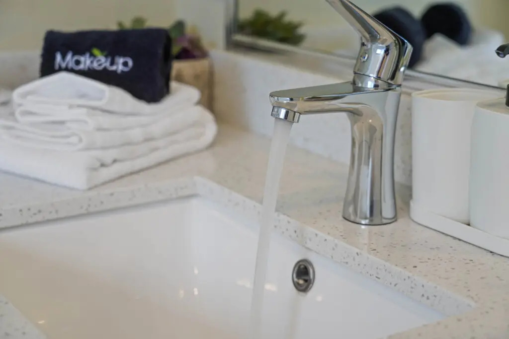 Elegant details and thoughtful touches bring a spa-like feel to the third-floor bathroom. Fresh towels, sleek chrome fixtures, and soft lighting create a serene space for guests to unwind and refresh in effortless comfort.