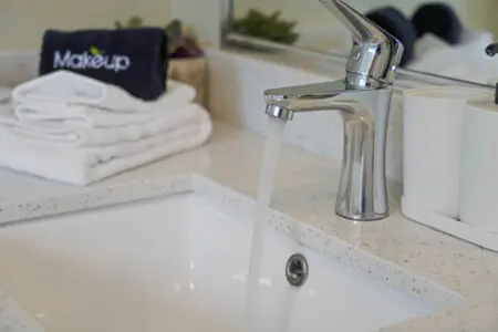Elegant details and thoughtful touches bring a spa-like feel to the third-floor bathroom. Fresh towels, sleek chrome fixtures, and soft lighting create a serene space for guests to unwind and refresh in effortless comfort.