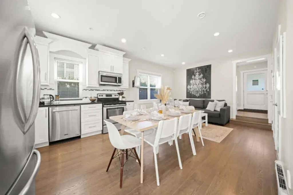 This bright open-concept space connects the kitchen, dining, and living areas seamlessly. Perfect for sharing meals, relaxing, and enjoying cozy evenings together.