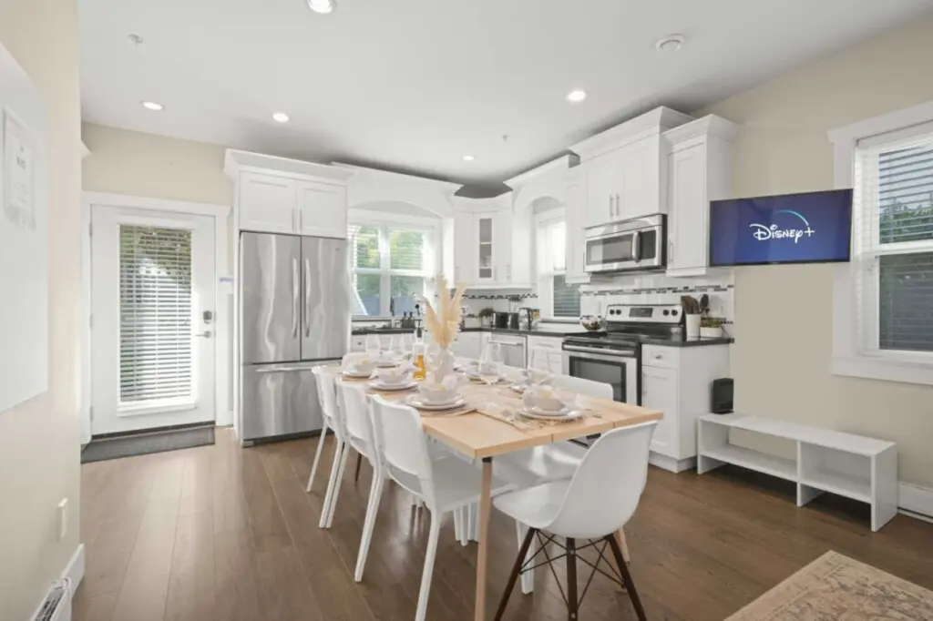 This bright open-concept kitchen and dining area offers a welcoming space for shared meals and connection. With seating for eight and modern finishes throughout, it’s perfect for family dinners or relaxed evenings in.