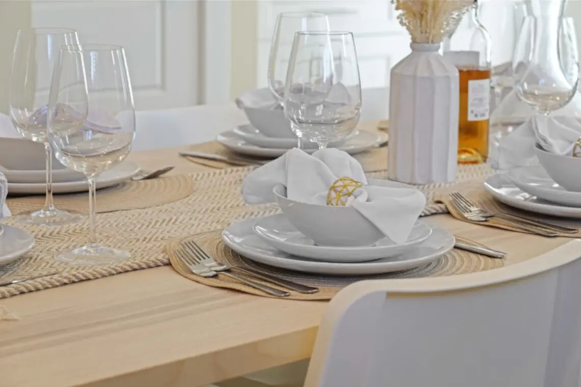 Elegant Dining — this beautifully set table invites guests to gather for meals and meaningful conversation. With seating for eight and space for up to ten, it’s perfect for family dinners, relaxed brunches, or cozy evenings in.