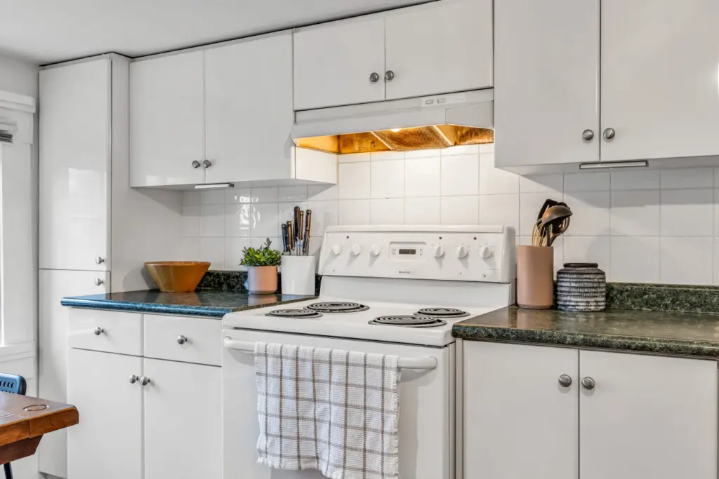 A functional kitchen featuring modern appliances, generous counter space, and clean, minimalist cabinetry for a smooth cooking experience.
