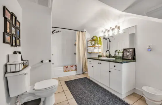 A comfortable sectional sofa, wall-mounted TV, and thoughtful decor including a world map, perfect for relaxing or planning your next adventure.