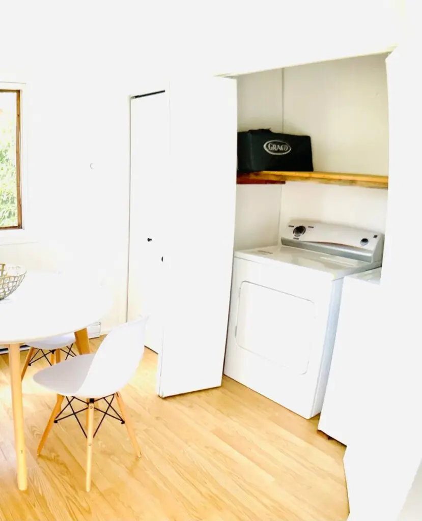 Convenient laundry nook with modern washer and dryer, offering a practical and space-efficient solution for your stay.