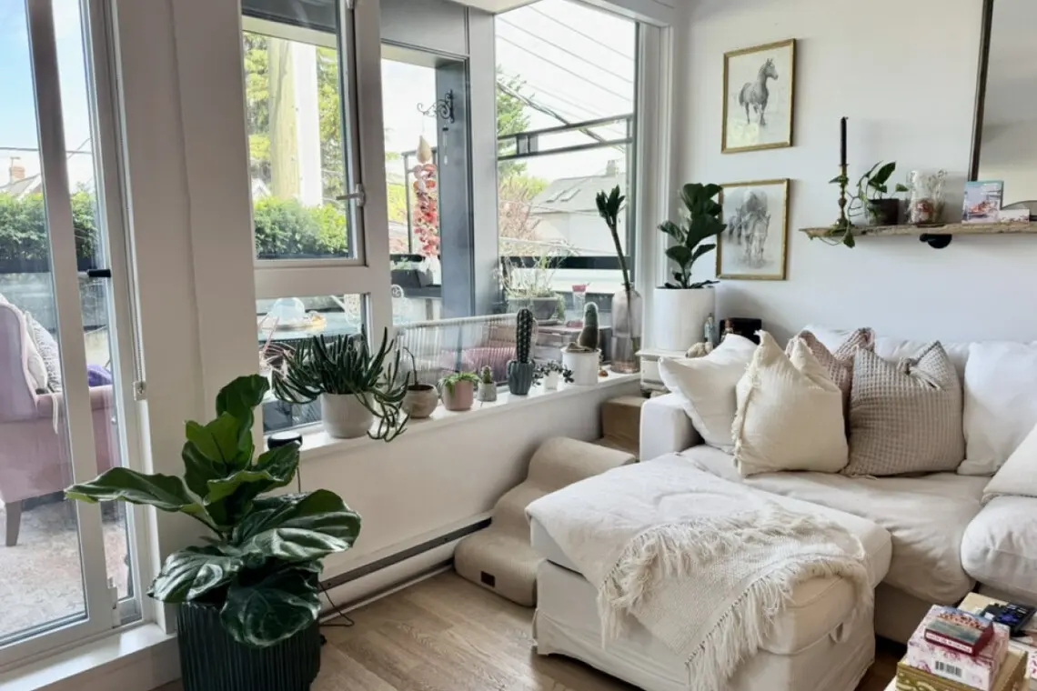 Cozy vibes and natural light. Perfect spot to relax, read, or enjoy your morning coffee while feeling connected to the outdoors.
